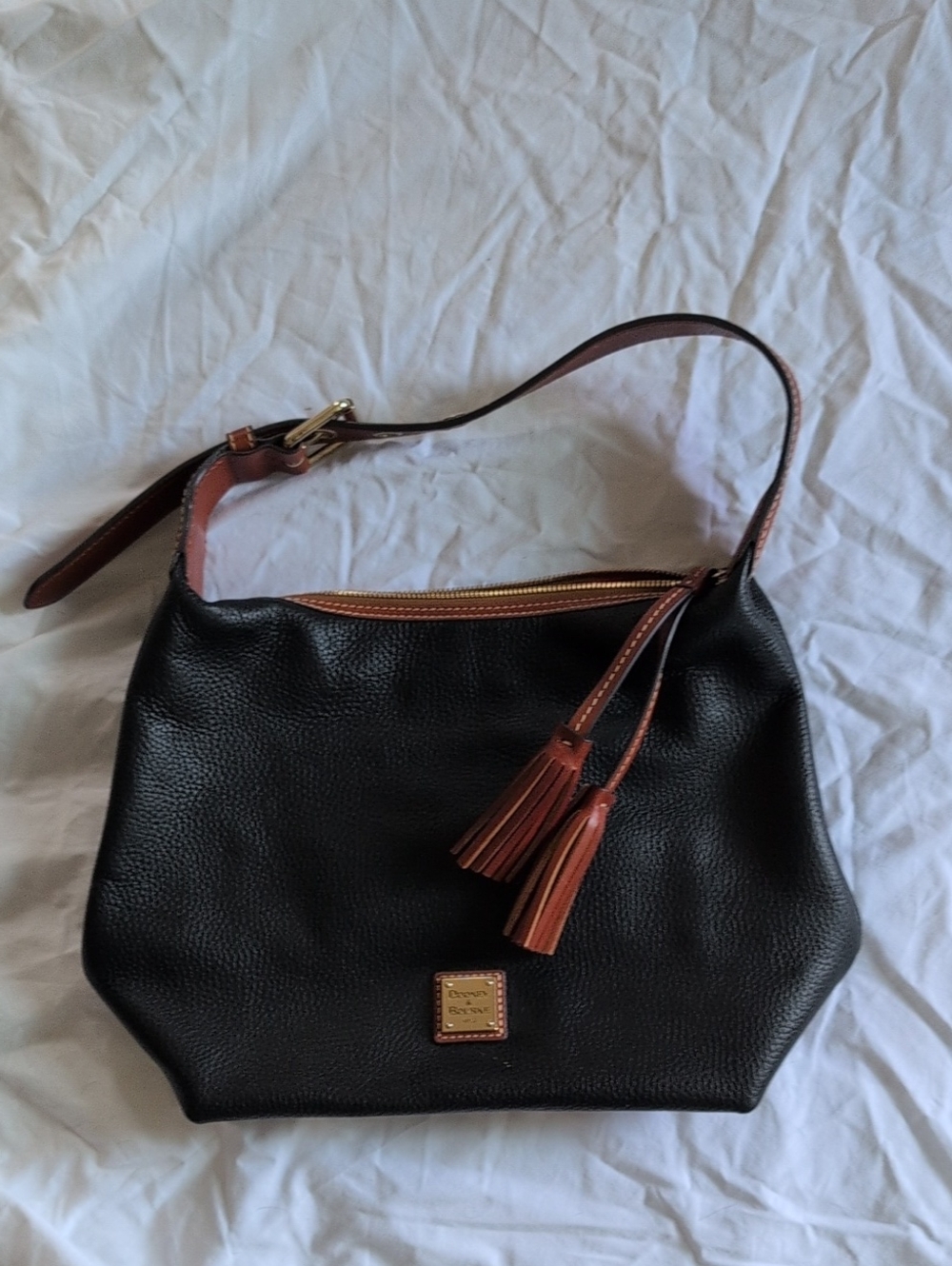 Dooney & Bourke Black Leather Shoulder Bag with Brown Trim and Tassels